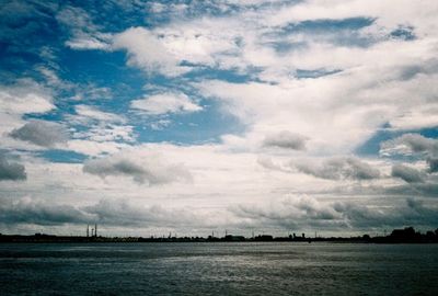 Scenic view of sea against cloudy sky