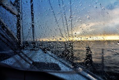 Full frame shot of wet glass window in rainy season