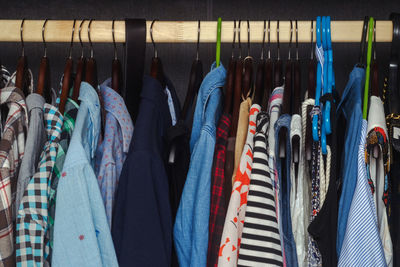 Men's and women's clothing on a hanger in the closet