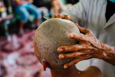 Close-up of man holding ball