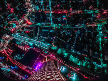 High angle view of illuminated buildings in city at night