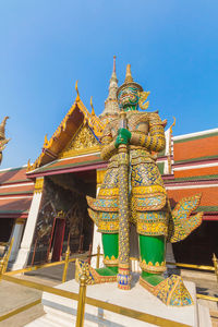 Low angle view of temple against building