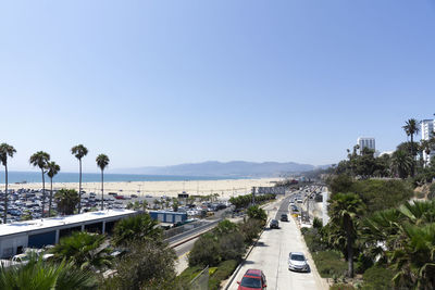 Scenery of santa monica. beach, mountains and highway along trees