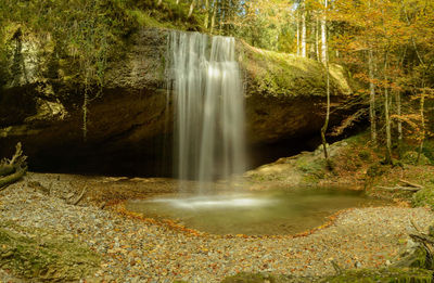 View of waterfall in forest