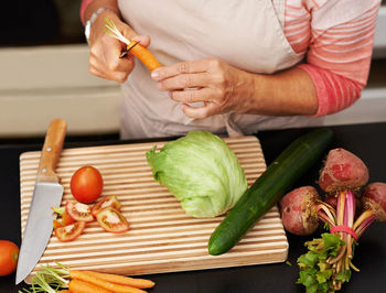 Midsection of man preparing food on table
