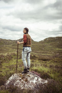 Active hiker in sunny scottish highlands