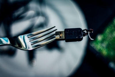 Close-up of usb stick on fork