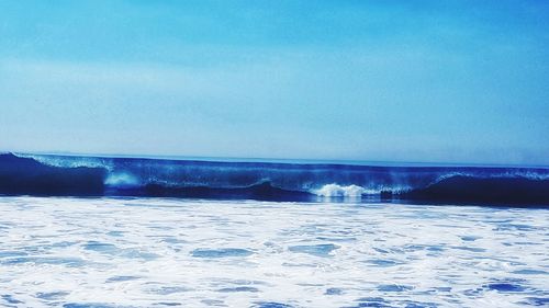 Scenic view of sea against sky during winter