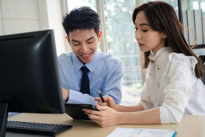 Colleague working in office