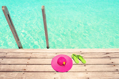 High angle view of pink ball on swimming pool