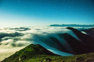 Scenic view of landscape against sky at night