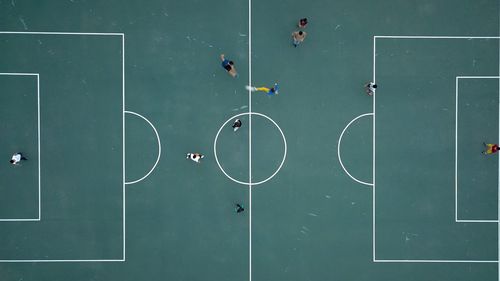 High angle view of people playing soccer on field