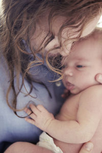 Mother embracing baby