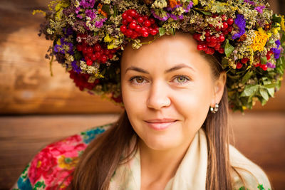 Young pretty ukrainian woman with a wreath of dry herbs on her head