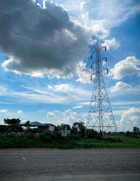 Low angle view of electricity pylon against sky