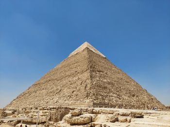 Low angle view of building against clear blue sky