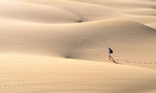 Tourists on sandy beach