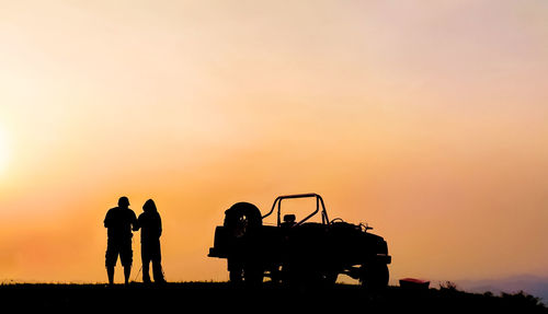 Silhouette people at sunset