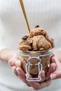 Close-up of hand holding ice cream