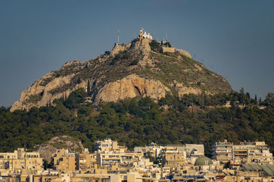 High angle view of townscape against clear blue sky