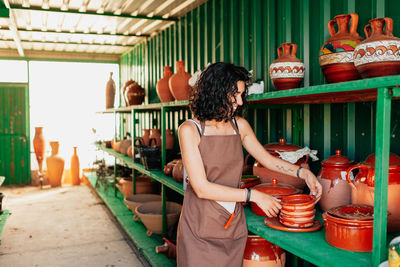 Woman working at market stall