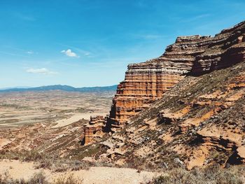 Rock formations on mountain against sky