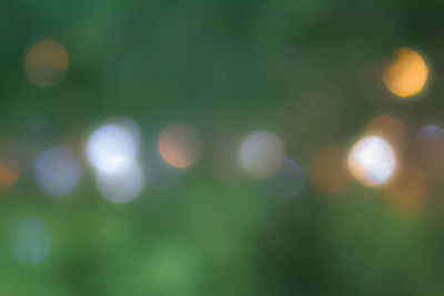 Defocused image of illuminated lights at night