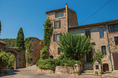 View of old stone houses on alley at les arcs-sur-argens, in the french provence.