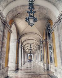 People in corridor of building