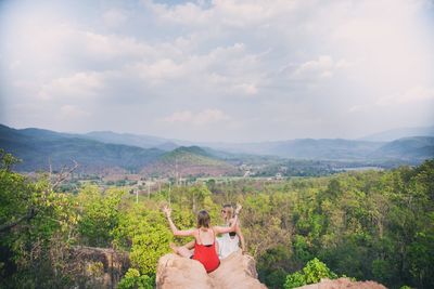 Scenic view of mountains against cloudy sky