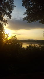 Scenic view of landscape against sky at sunset