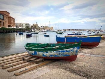 Boats moored at harbor