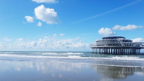 Panoramic view of sea against blue sky