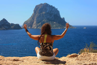 Rear view of woman looking at sea