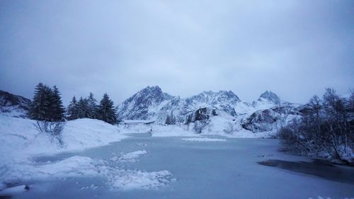 Scenic view of snow mountains against sky