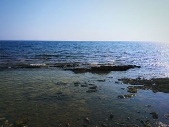 View of calm blue sea against clear sky