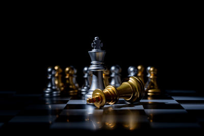 Close-up of chess board against black background