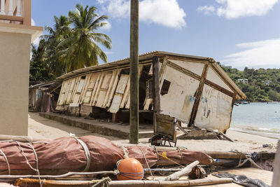 Panoramic view of people on beach against sky