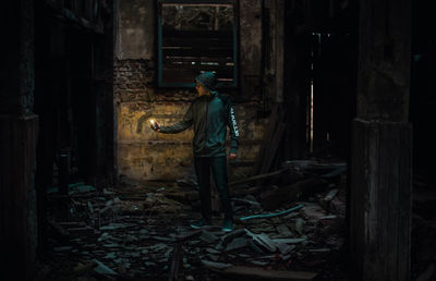 Full length of man standing in abandoned building