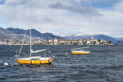 Sailboat on sea against sky