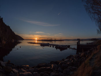 Scenic view of sea against sky at sunset