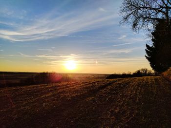 Scenic view of landscape against sky during sunset