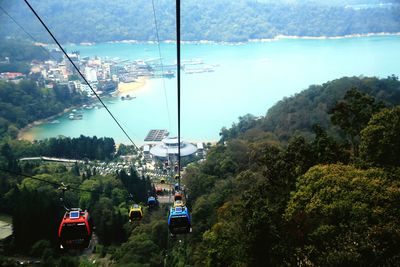 High angle view of overhead cable car against sun moon lake