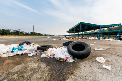 Abandoned tires and garbage at parking lot