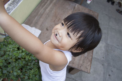 Close-up of cute boy playing in back yard