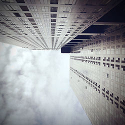 Low angle view of building against cloudy sky