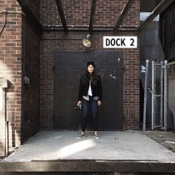 Full length of woman standing in park