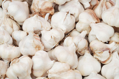 Full frame shot of onions for sale at market