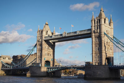 Bridge over river with city in background