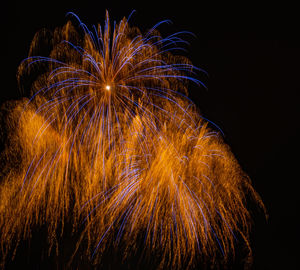 Long exposure abstract sparks from a new year's eve fireworks for backgrounds